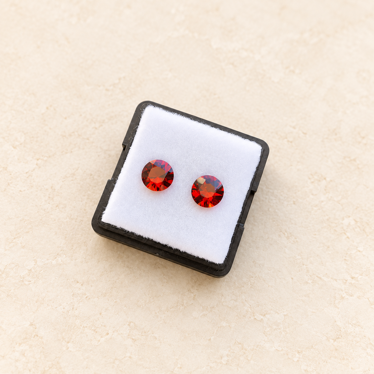 Pair of Brazilian Rio Grande topaz stones on an ivory studio background